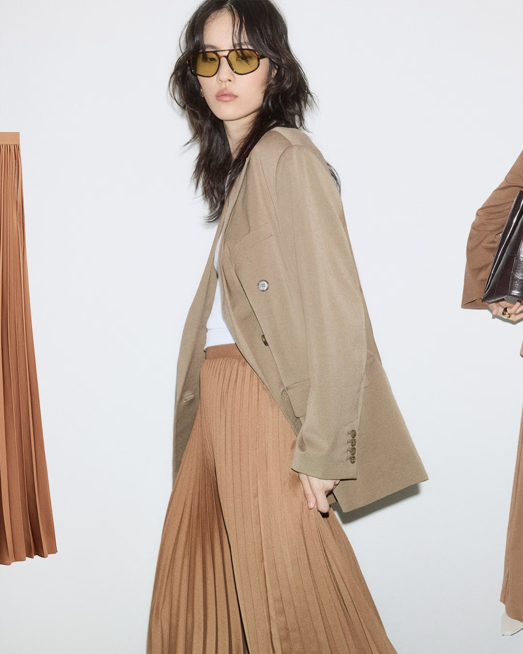 H&M pleated caramel skirt styled with tailored neutral layers