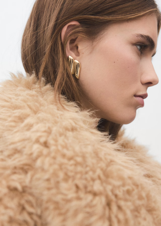 Modern Muse gold statement earrings with geometric relief styled for elegant fall outfits