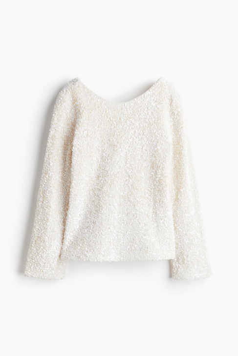 Sequined top balanced with soft textures for modern winter elegance