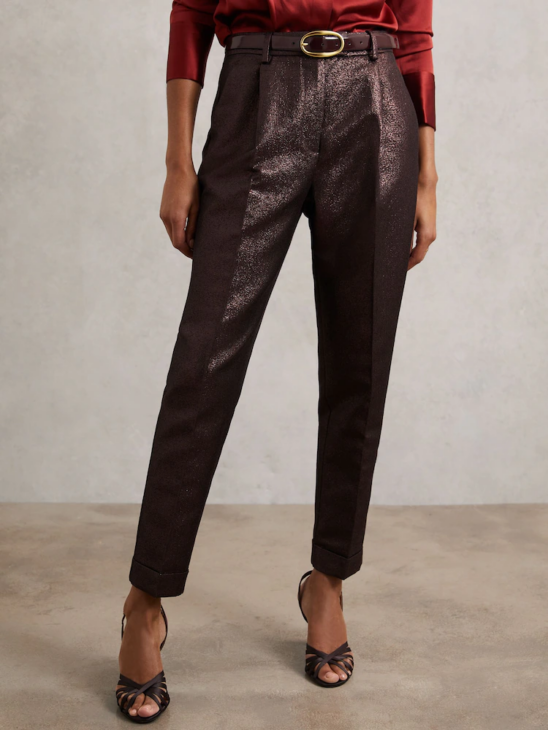 Metallic suit trousers styled for modern textured winter elegance