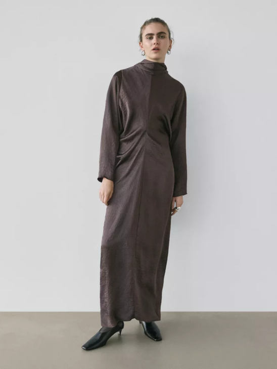 Long flowing winter dress styled for textured winter elegance with fluid silhouette