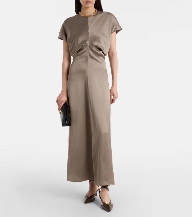 Draped satin maxi dress creating textured winter elegance for evening wear