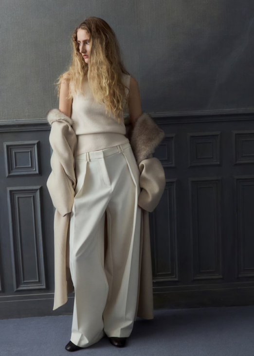 Soft turtleneck knit top in neutral tone for winter white layering