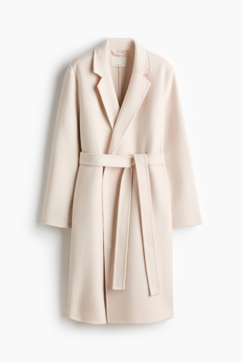 Ivory longline wool coat styled in a winter white outfit
