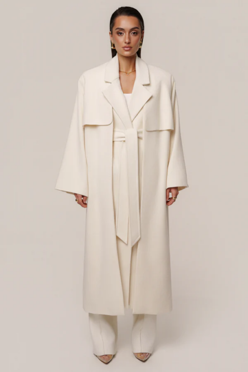 Ivory long coat styled in soft winter white layers for elegant cold weather outfits