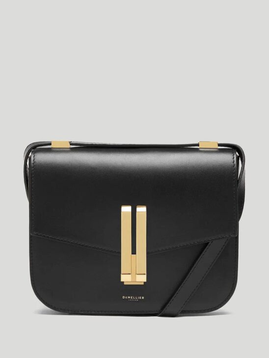 Structured leather bag completing a modest luxe outfit