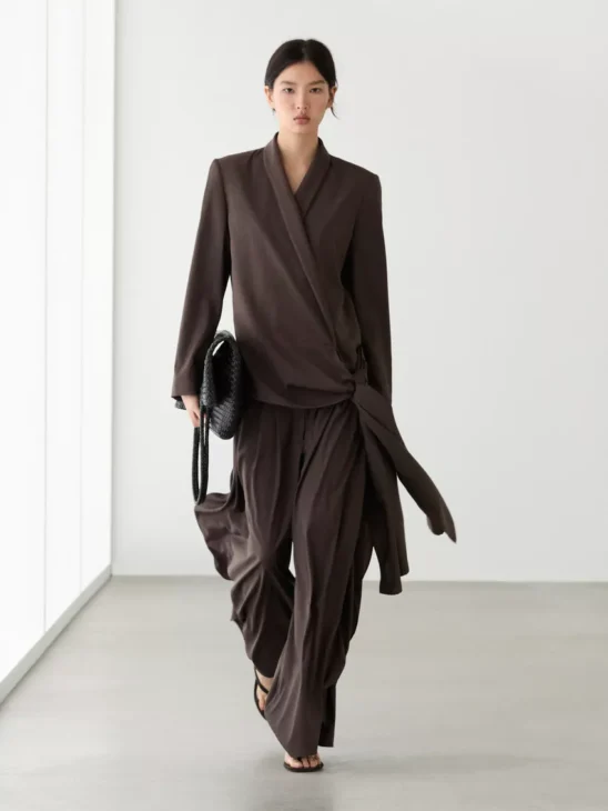 Tailored blazer layered over a modest dress for a refined look